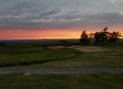 Photograph of Mount Agamenticus summit view to the north during an early summer sunset.